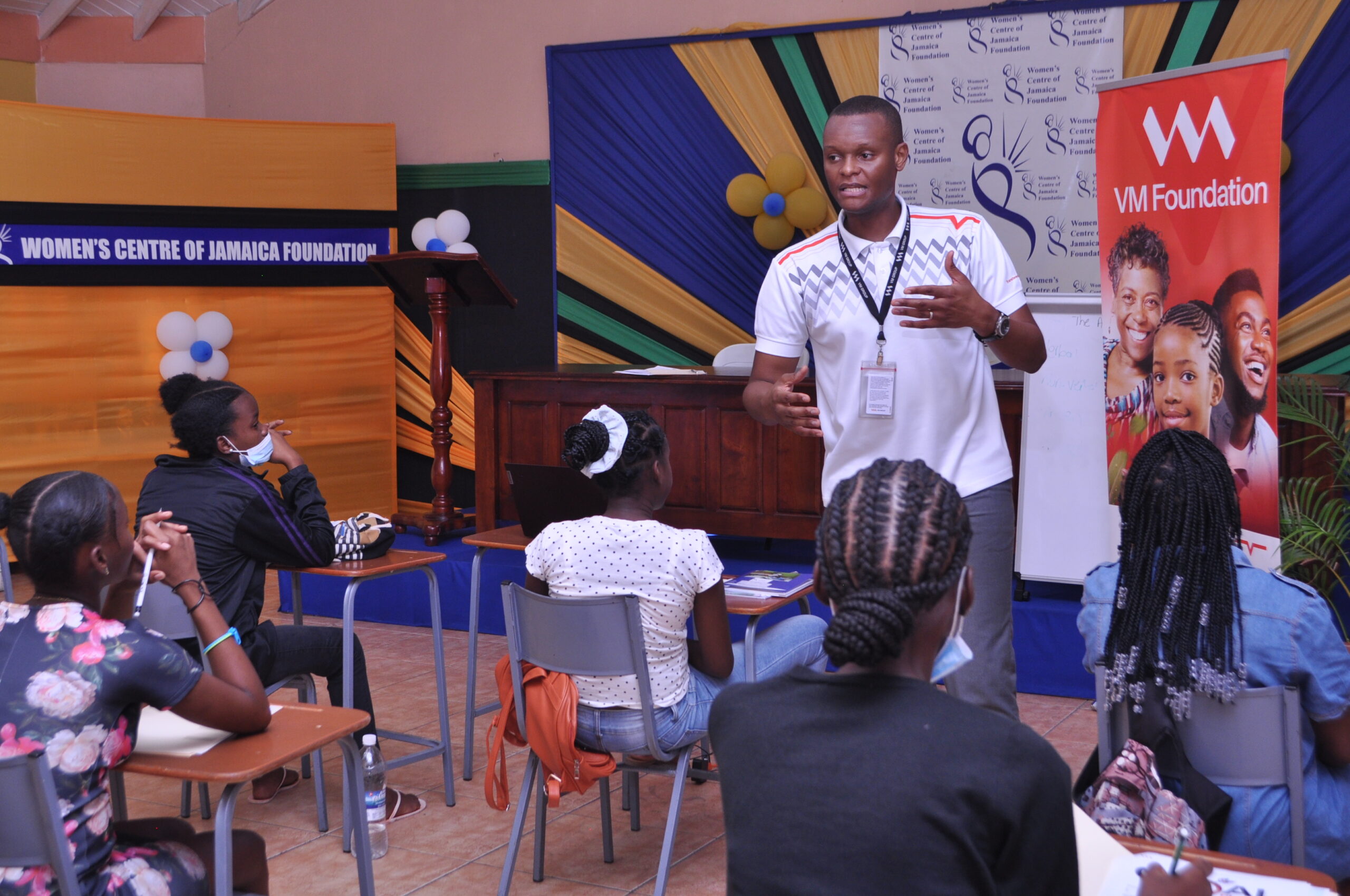Andre Alleyne, Assistant Supervisor for Customer Service at VM Building Society - New Kingston Branch, leads an introductory financial literacy session as part of the activities for the Finishing School Programme for Adolescent Mothers, an initiative of the Women’s Centre of Jamaica Foundation.