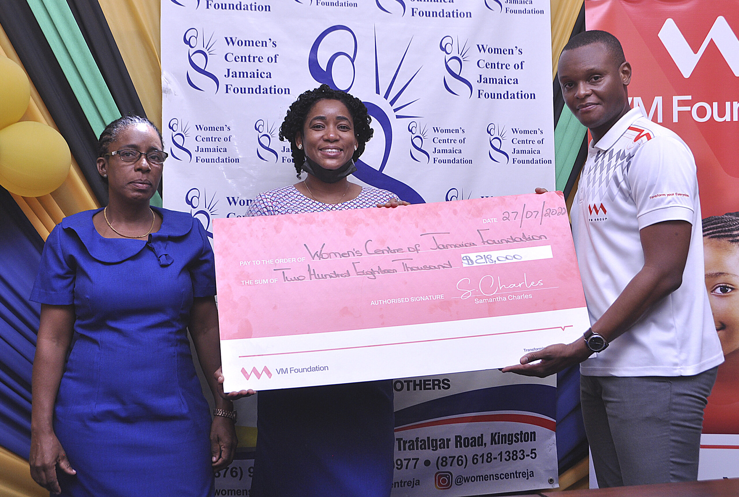 (From left)  Natalie Fuller, Projects Coordinator, and Marlene Murray-Brown, Counsellor at the Kingston Office of the Women’s Centre of Jamaica Foundation, receive a cheque courtesy of the VM Foundation. Making the presentation is Andre Alleyne, Assistant Supervisor for Customer Service at VM Building Society - New Kingston Branch.